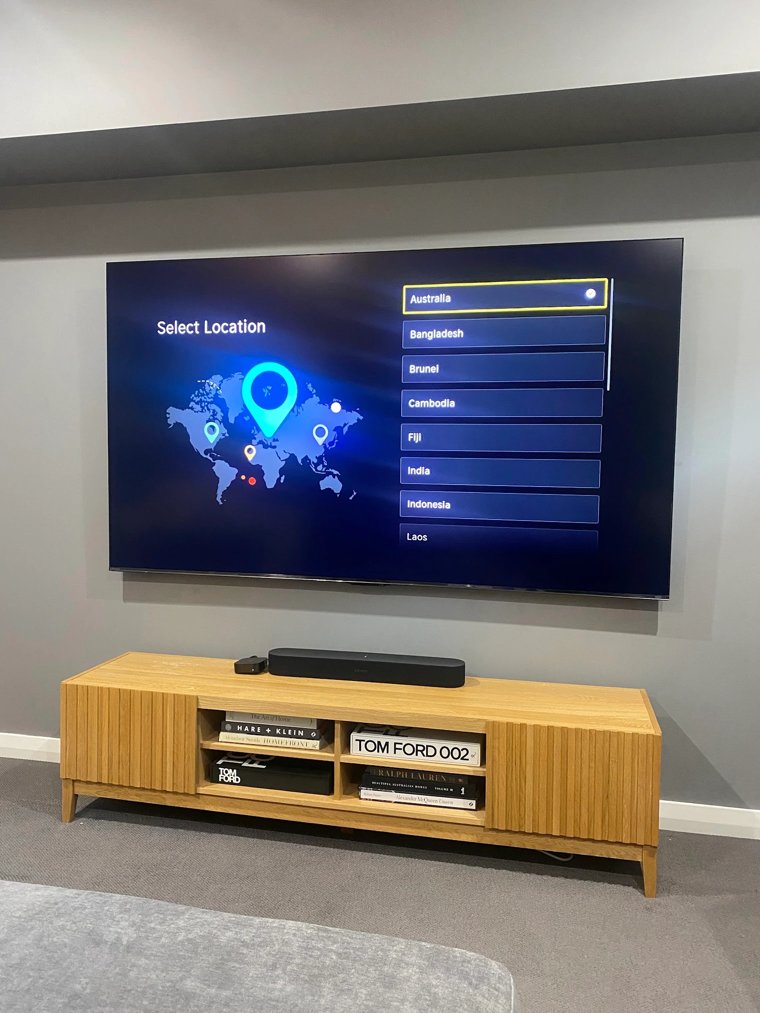 Large format TV mounted on a feature wall